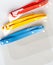 Set of three colorful protective face shields, closeup, closed composition. Group of anti viral plastic portable protection