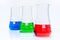 Set of three conical temperature resistant flasks with color liquid