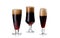 set of three elegant glass of dark beer with foam isolated on white...