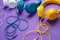 Set of three headphones over purple background. Music concept.