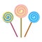 A set of three round spiral lollipops. Colorful sweet lollipops on a stick. Children s sweets. New Year s candy