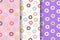 Set of three Seamless pattern of doughnuts with colored icing. Trendy beautiful donuts White, pink and purple background