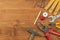 Set of tools and instruments on wooden background. Different kinds of tools for household chores. Home repairs. Father\'s Day.