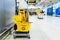 A set of tools and plates for mopping at the airport. Yellow bucket plates and brushes. Cleaning Service