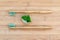 Set of two bamboo toothbrushes and solid toothpaste on wood. Zero waste, plastic free, environment concept