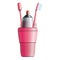 Set of two pink toothbrushes, toothpaste and cup