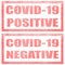 Set of two stamps with red text on a white background. Covid-19 positive, Covid-19 negative. Virus testing