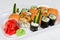 A set of types of rolls and sushi with salmon and cucumbers