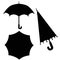 Set of umbrella silhouettes - open top view, open side view and closed.