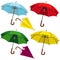 Set of umbrellas. Umbrellas of different colors opened and collected on a white isolated background