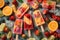Set of unique colorful summer popsicles with fresh fruits and ice cubes