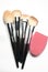 Set of used makeup brushes with metal handles and rubber brush c