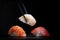 Set of various classic nigiri sushi on a black stone background