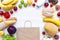 Set of various groceries with paper bag on white wooden table. Cooking food background. Flat lay of fresh foods. Top view, overhea