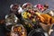 A set of various herbal and fruit teas in glass jars on a dark background. Medicinal herbs. A natural, eco product