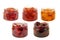 A set of various jams in a transparent glass jars on a white background