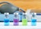 Set of various medical vials for injections. Ampoules with a liquid medication blue, pink and green colors. Small bottles with inj