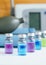 Set of various medical vials for injections. Ampoules with a liquid medication blue, pink and green colors. Small bottles with inj