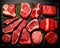 Set of various raw steaks like chateau mignon, t-bonnet, tomahawk, striploin, tenderloin, tenderloin, new york steak.