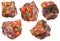 Set of various realgar crystals on rocks isolated