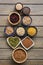 A set of various superfoods , whole grains,beans, seeds, legumes in bowls on a wooden plank table. Top view, copy space