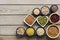 A set of various superfoods â€” whole grains,beans, seeds, legumes in bowls on a wooden plank table. Top view, copy space