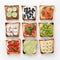 Set of various toasts with fruit, vegetable, fish and sausage and cheese on white baking paper.