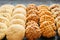 Set of variuos american style cookies on a black stone background. Shortbread, snickerdoodle, peanut butter, oatmeal and pecan co