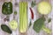 Set of vegetables on white painted wooden background: kohlrabi, pepper, cabbage, broccoli, avocado, rucola, brussels sprouts, cele