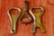 Set of vintage bottle openers on brown wooden background