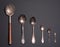 The set of vintage spoons of different metals and sizes