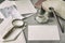 Set of vintage stationery, wooden pen, inkwell, magnifier and envelopes, letters close up. Writing a letter. Memory and