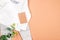 Set of warm baby clothes with bodysuits and tag on beige background. Collection of cute baby clothes. idea Gift for the birth of