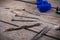 Set of watchmaker tools isolated on a rough wooden board