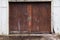 A set of weathered shed barn doors with faded paint as an abstract background