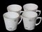 Set of white cups isolated on black