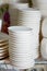 Set of white dishes on white.Stack of plates