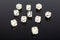 Set of white gaming dice on black background