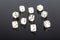 Set of white gaming dice on black background
