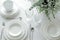 A set of white glassware. Table setting top view