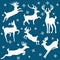 Set of white silhouettes of horned deers on blue background