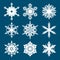 Set of white snowflakes isolated on blue background. Vector.