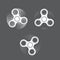 Set of white spinning fidget spinners on gray background