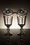 Set of wine glasses and glass sauce cups on darken background