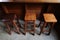 A set of wooden chair and bar counter in chinese style with concrete floor on woden wall at coffee shop