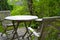 A set of wooden and lightly weathered patio furniture on a terrace