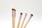 Set of wooden makeup brushes on white background