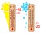 Set of wooden thermometers low and high temperature with sun and snowflakes