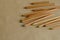 Set of wooden used pencils randomly on the table