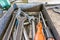 A set of working tools of a repairman`s fitter, open-end wrenches and screwdrivers are in a metal box during the repair process